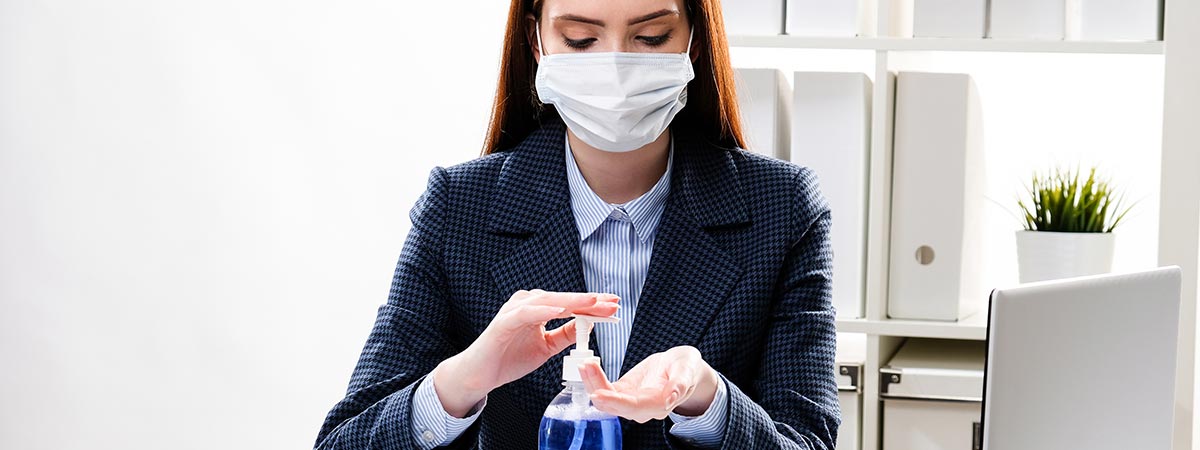 Woman applying hand sanitizer/disinfectant